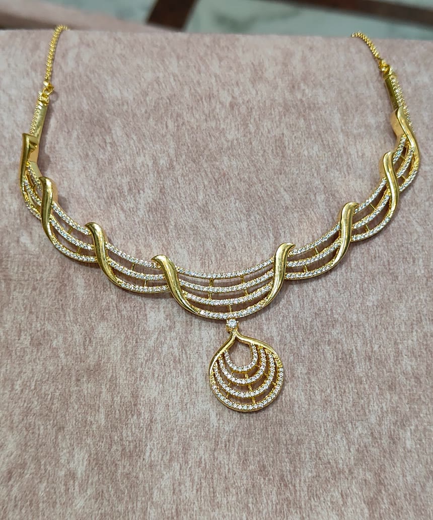 Layered Diamond Necklace — Five fine strands falling to a teardrop drop. Reserve online, try it on at the shop.